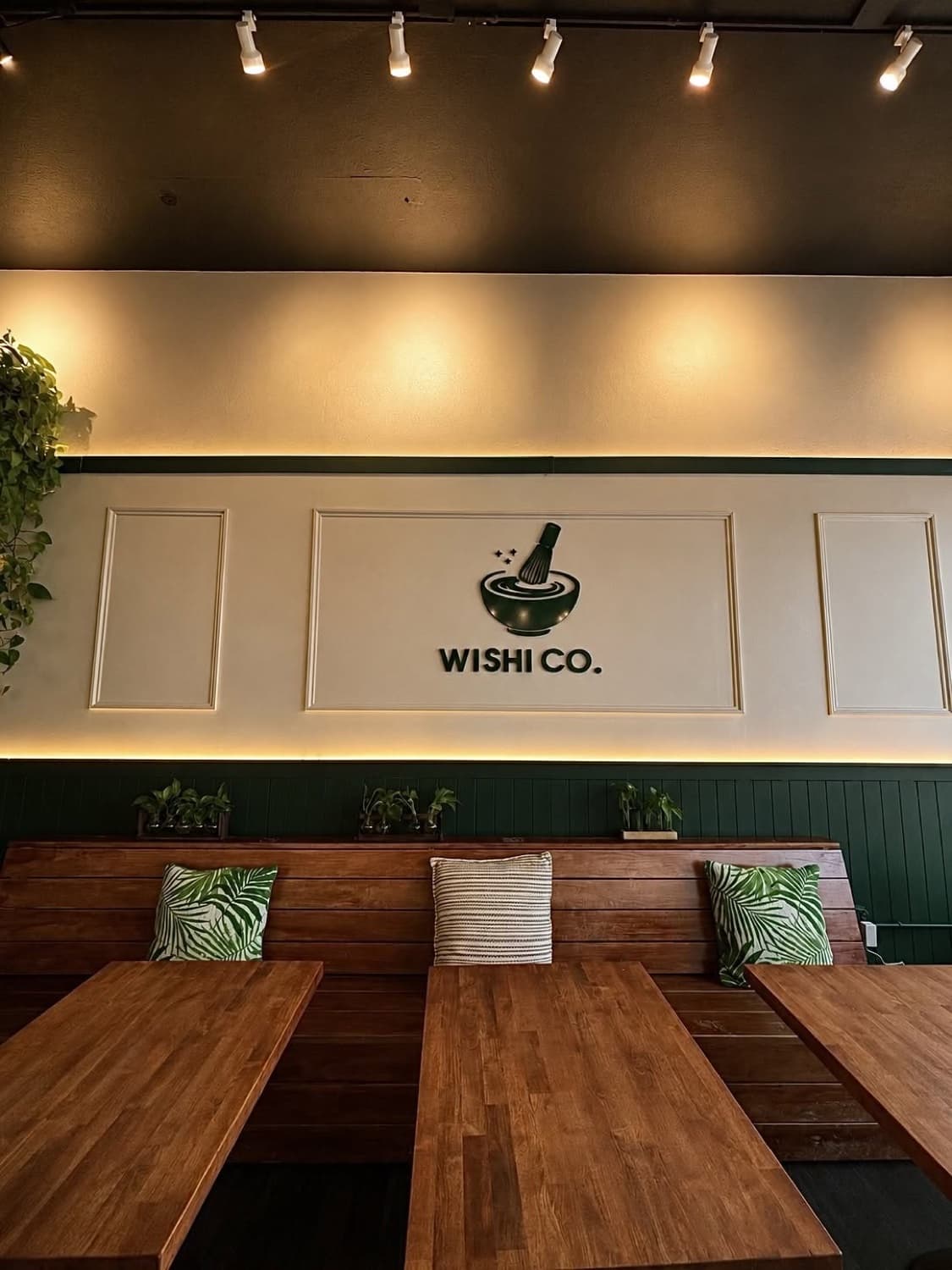 The Wishi Co. dining room and logo wall on Eat Street in Whittier, Minneapolis.