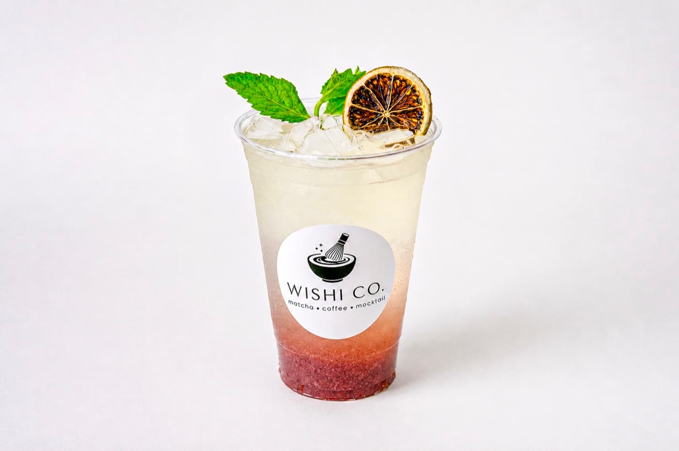 A zero-proof craft drink with fresh mint and a charred citrus wheel at Wishi Co. in Minneapolis.